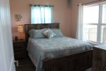 Natural Light in the Master Bedroom with a Queen Bed